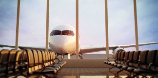 Stabbed Captain Unlocks Door – Chaos Erupts Airplane seen through terminal windows with empty gate seating
