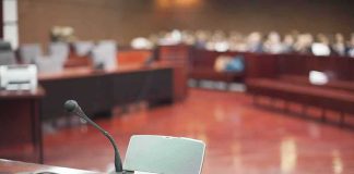 Conference microphone on a desk in a courtroom