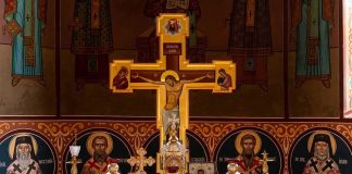 War Bureaucracy Grabs Priest – Papers Ignored Orthodox church altar with large gilded cross and icons