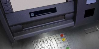 Someone Left $128K on Top of an ATM Close-up of an ATM keypad with numeric buttons and function keys
