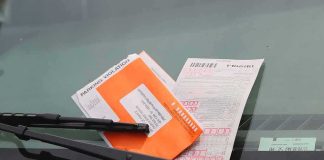 parking ticket under windshield wiper