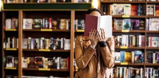 Bookstore Shrine Sparks Law-And-Order War Person reading a book in a bookstore aisle
